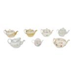 Seven early 19th century and later teapots, including a Minton tea pot of oval form with gilt
