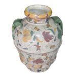 A large mediterranean hand painted terracotta vase, with twin handles, decorated with a fleur de lys