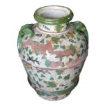 A large mediterranean hand painted terracotta vase, with twin handles, profusely decorated with