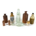 A group of stoneware and glass bottles, including one by Lovatt & Lovatt Ltd, 20cm, and a Rawlings