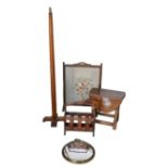 A group of furniture, comprising an embroidered fire screen, 59 by 25.5 by 79cm high, a standard
