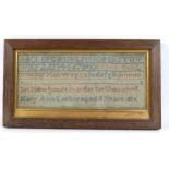 A Victorian sampler, with the alphabet embroidered, signed and dated 'Mary Ann Locker, Aged 11
