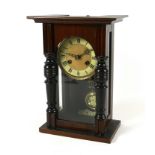 An early 20th century mahogany and stained pine Vienna wall clock, with pendulum and key, a/f