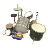 A vintage Premier drum kit, with several pedals, sticks, and seat.