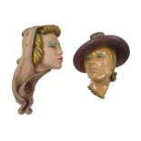 Two Art Deco Jon Douglas (John Pearce) plaster wall hanging female face masks, both signed verso. (