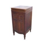 An Edwardian oak gramophone cabinet, with more modern turntable fitted to the top, the cabinet below