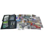 A collection of over fifty assorted British stamp presentation packs, together with sixteen books of