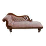 An Edwardian chaise longue, with pale pink button back upholstery and mahogany frame, a/f, 182 by 58