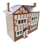 A scratch built wooden doll's house with accessories, its double opening front conceals four