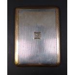 An Asprey George V silver and yellow metal cigarette case, mounted initials to the front 'GB',