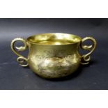 An Edwardian Britannia silver gilt twin handled bowl, with planished effect sides and snake form