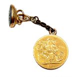 An Edward VII gold sovereign, 1906, Melbourne, Australia mint, with yellow metal chain and fob,