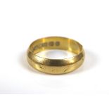 An 18ct gold ring, size L/M, 3.7g.