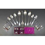 A group of silver and silver plated flatware, including two fiddle pattern basting spoons, 30cm, two