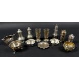 A group of Edwardian and later silver pepper pots and salts, including a pair of pepper pots,