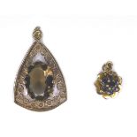 Two 9ct gold precious/semi precious stone pendants, comprising a seven stone blue sapphire