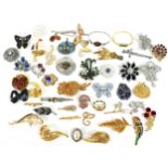 A group of brooches, including a 9ct gold bi-coloured brooch in the form of a dolphin, 2.3g, a