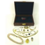 A small group of costume jewellery, including a faux pearl necklace, a gold plated fringe