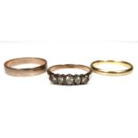 A group of three gold rings, comprising an 18ct gold wedding band, 2.5mm wide, size P, 2.7g, a 9ct
