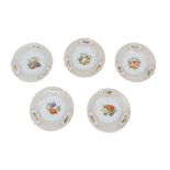 Five early 20th century continental hand-painted plates, each decorated with fruit and foliage