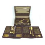 A canteen of SBS Bestecke Solingen 24ct gold plated cutlery, a/f not complete, in brown