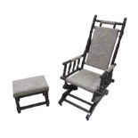 An American rocker, with turned mahogany frame and supports, with upholstered back, seat and