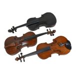 Three 19th century violins, comprising one labelled 'Joseph Guarnerius fecit Cremonae anno 1775',