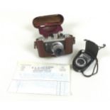 A Corefield Periflex 35mm camera, Lumar-X lens, circa 1930s, in brown leather case, plus a Unattix