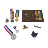 Two sets of WWI medals with recipients from the same family, comprising a 1914-15 star, War medal