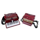 Two small piano accordions, one by Delicia and the other by Stella, both without cases. (2)