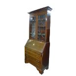 An Edwardian mahogany bureau bookcase, shell inlay, over four drawers with brass swan neck