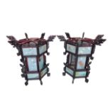 A pair of very large Chinese hexagonal carved hardwood lanterns, with painted glass panels, 102.5 by