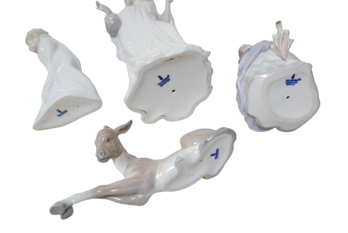 Four Lladro figurines, comprising a 'Dainty Lady', 35cm high, 'Evita' girl with umbrella, 18cm high, - Image 2 of 3
