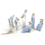 A collection of Lladro and Nao figurines, comprising 'Graceful Pose', boxed, 'Flirt', 'Wedding