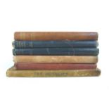 A group of cloth bound books, including three A. A. Milne Winnie The Pooh, Now We Are Six, The House