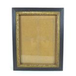 An ebonised and gilt wood glazed picture frame, inside 41 by 30.5cm, outer frame 52 by 42cm.