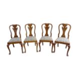A set of four mid 20th century walnut veneered dining chairs, in Queen Anne style, with drop in