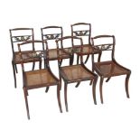 A set of six Regency style mahogany dining chairs, early to mid 20th century, with spiral rope twist