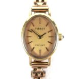 A Tissot Stylist 9ct gold lady's cocktail wristwatch, model 1061, serial 1515056, with oval gold