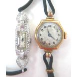 An Art Deco platinum and diamond set lady's cocktail wristwatch, the tank shaped case set with