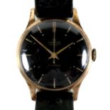 A vintage Smiths De Luxe gold plated gentleman's wristwatch, circa 1950's, circular black dial