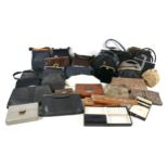 A collection of vintage handbags and jewellery boxes, including leather and embroidered examples,