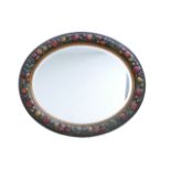 An oval Barbola mirror, with traditional fruit border, 79 by 67cm.