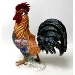 A Goebels figurine of a cockerel, with manufacturers marks to its base, 35cm high.