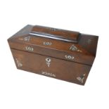 A Victorian oak sarcophagus form tea caddy with mother of pearl inlays