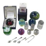 A collection of silver and paperweights, including three Caithness paperweights, one of the '