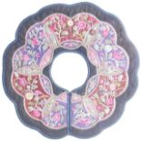 An early 20th century Chinese silk textile collar, of dodecagon form with floral design, 29cm