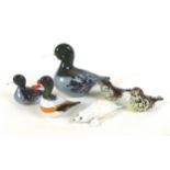 A collection of Langham Glass figurines, predominantly modelled as birds, including a large duck,