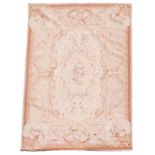 An Aubusson tapestry carpet, with a cream ground and floral decoration in typical pale colours,