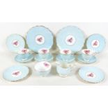 An Aynsley china part tea service, moulded leaf pattern in pale blue glaze centered by a painted